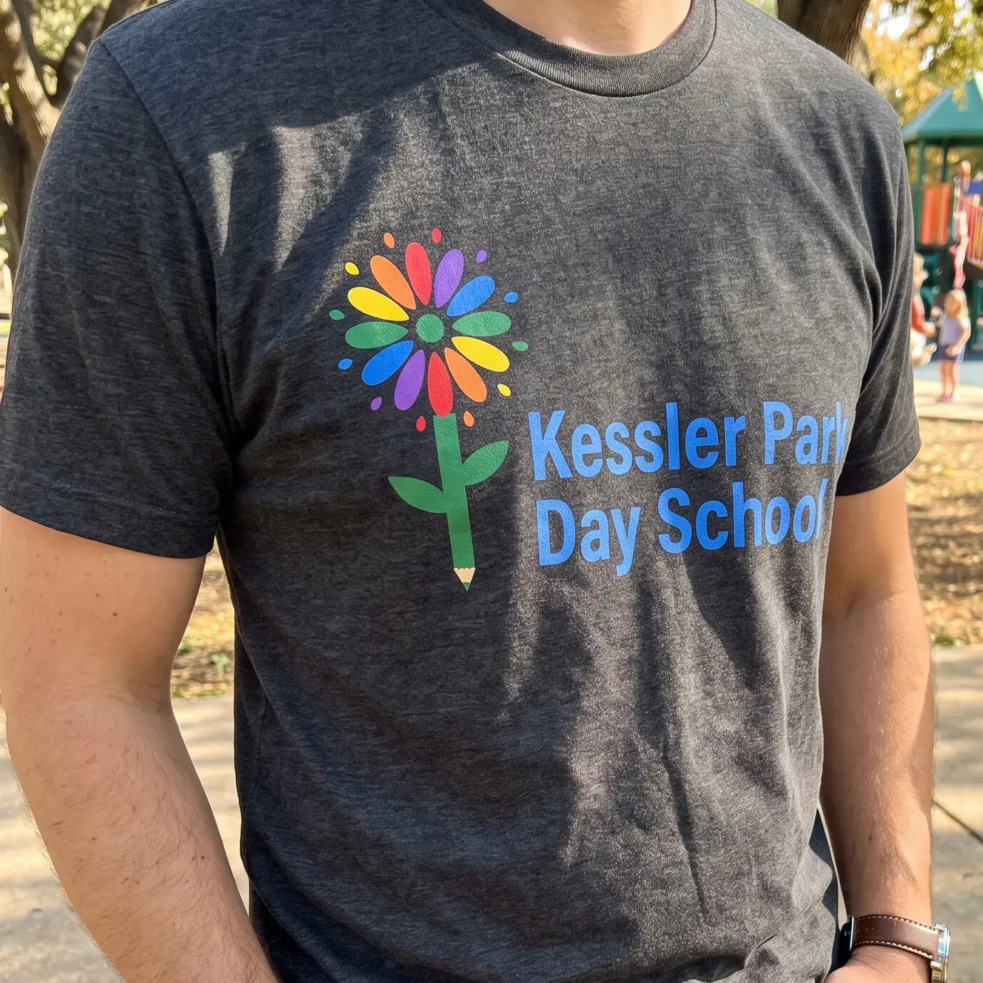 Heather grey tee with the Kessler Park Day School flower logo